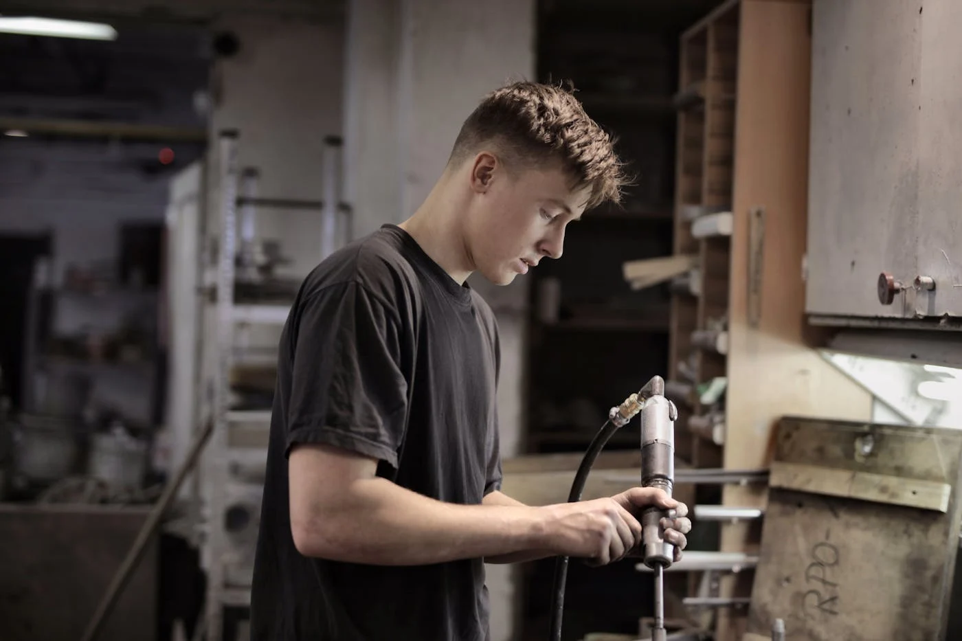 Mechanic working with workshop equipment